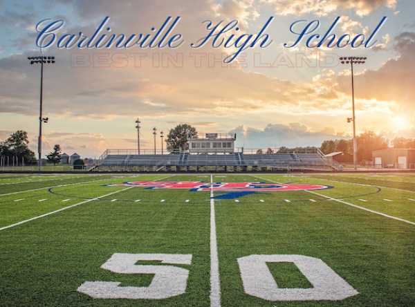 a football field with a stadium and bleachers