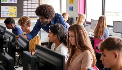 a group of people in a computer room